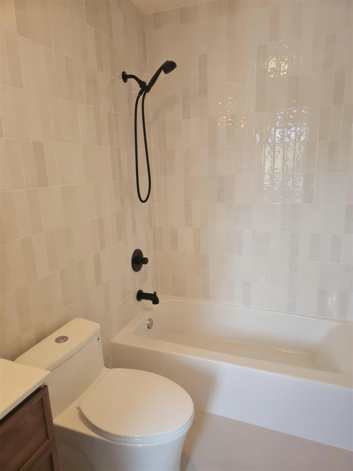 Master bathroom with zellige tile and matte black fixtures